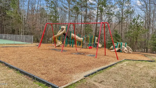 an aerial view of a house with a lake view
