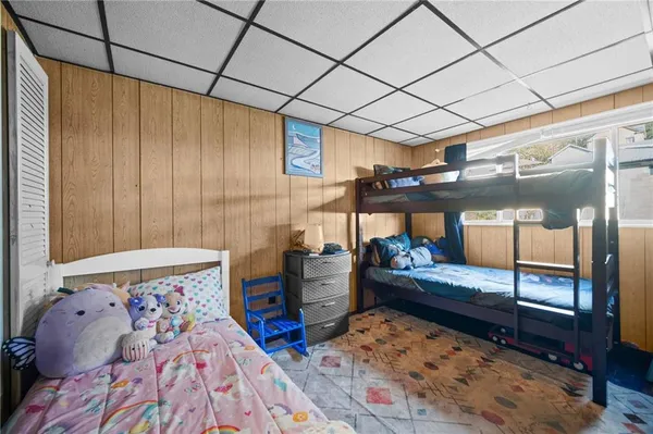 a bedroom with furniture and a wooden floor