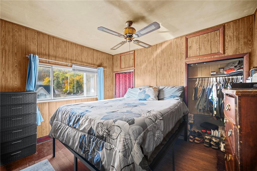 1412 Broadway Avenue McKees Rocks, PA 15136 - Photo 16 of 39 a bed sitting in a bedroom next to a window