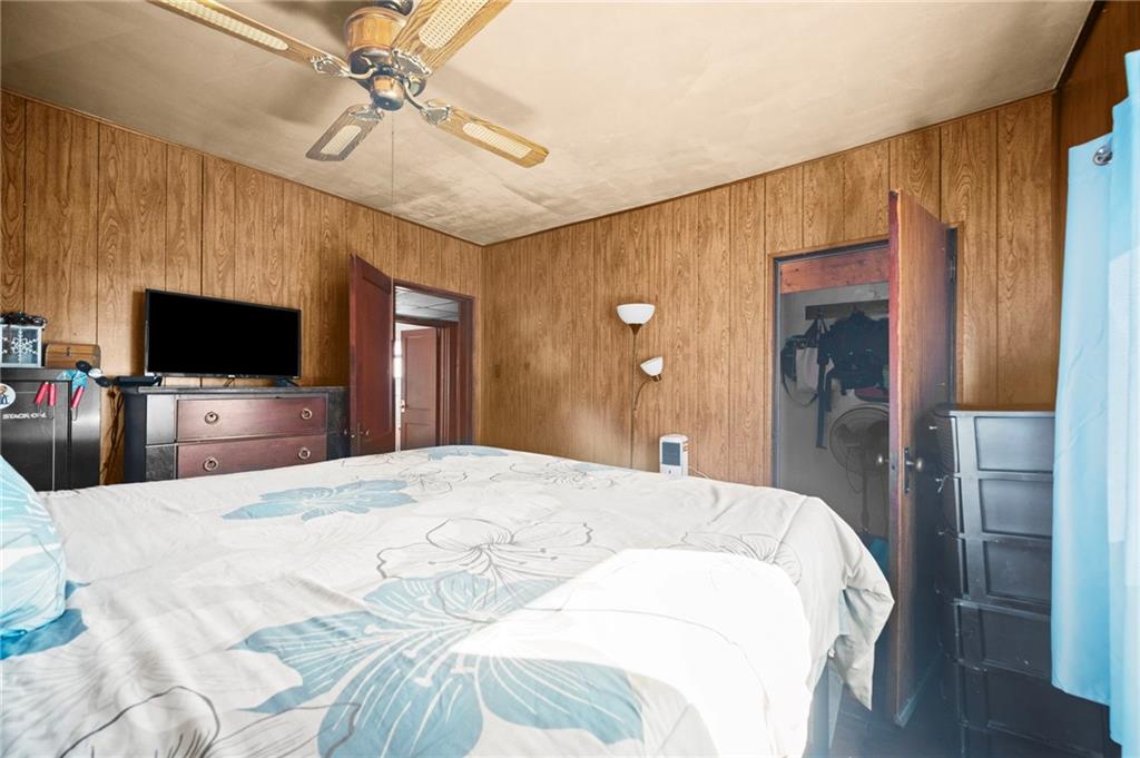 1412 Broadway Avenue McKees Rocks, PA 15136 - Photo 18 of 39 a bedroom with a bed and a flat screen tv