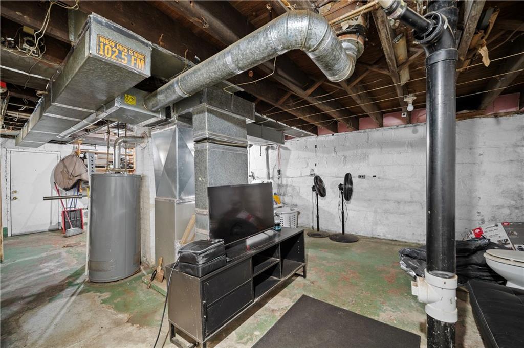 1412 Broadway Avenue McKees Rocks, PA 15136 - Photo 23 of 39 a living room with furniture and a flat screen tv