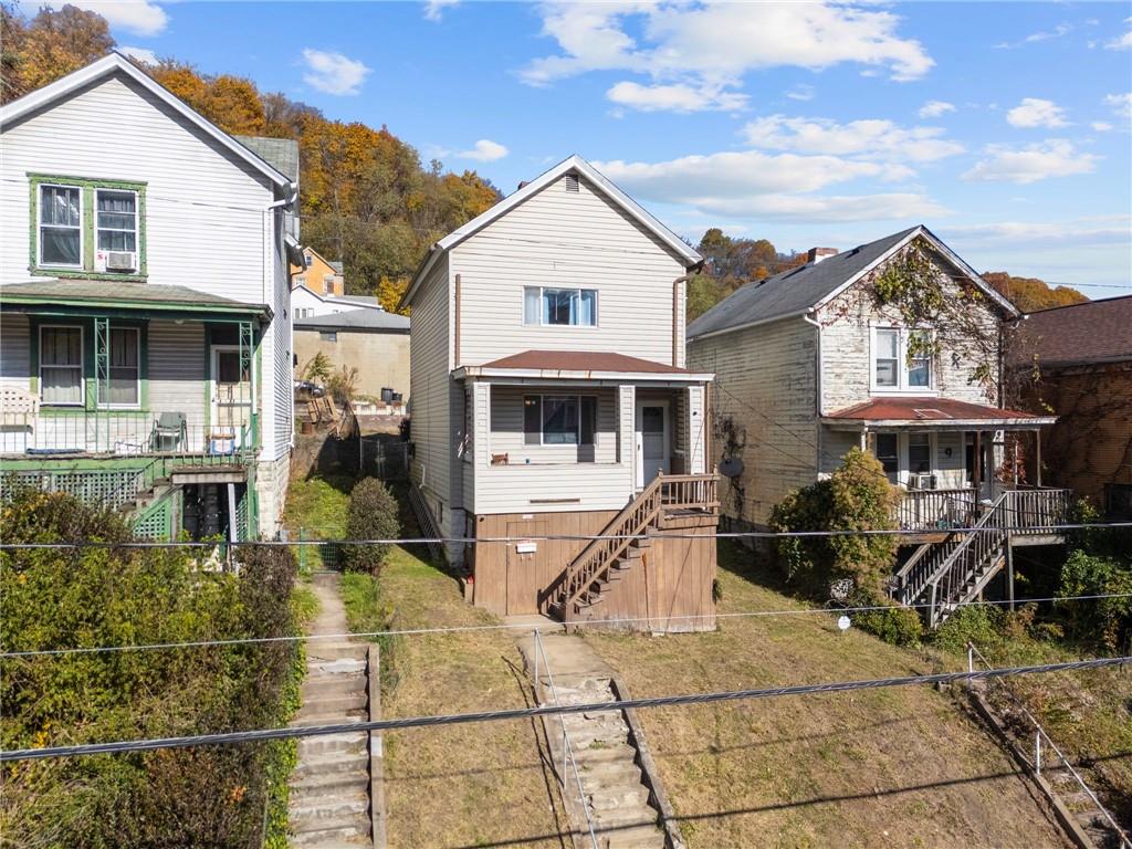 1412 Broadway Avenue McKees Rocks, PA 15136 - Photo 29 of 39 a front view of a house with a porch