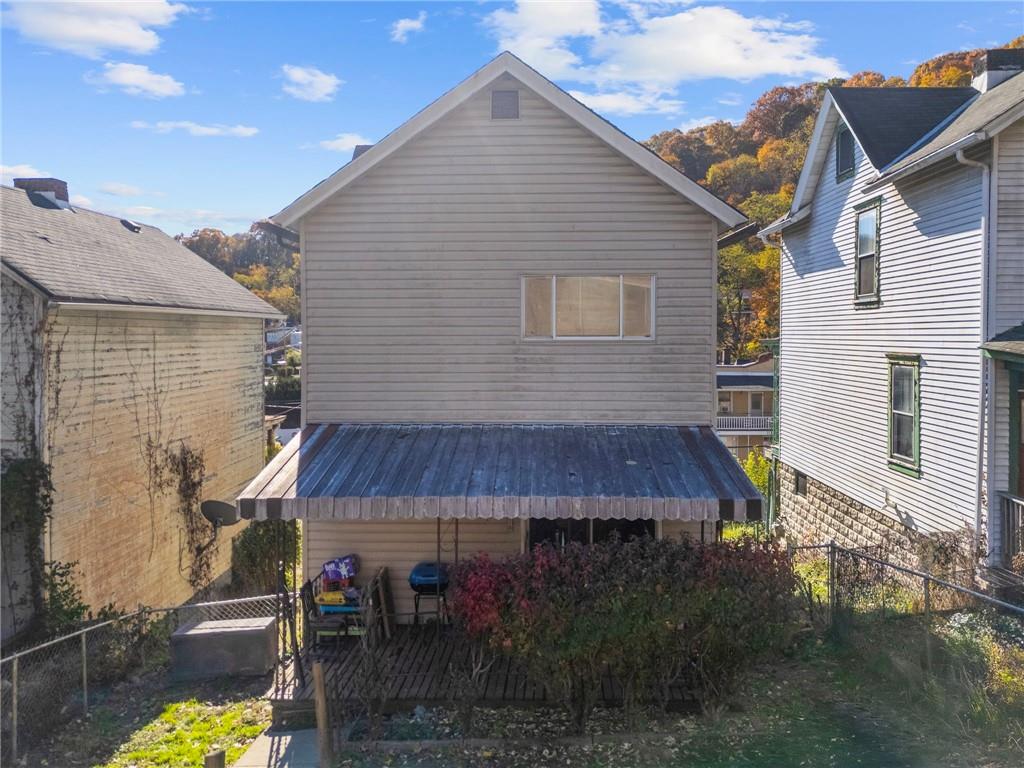 1412 Broadway Avenue McKees Rocks, PA 15136 - Photo 32 of 39 a view of a house with wooden fence