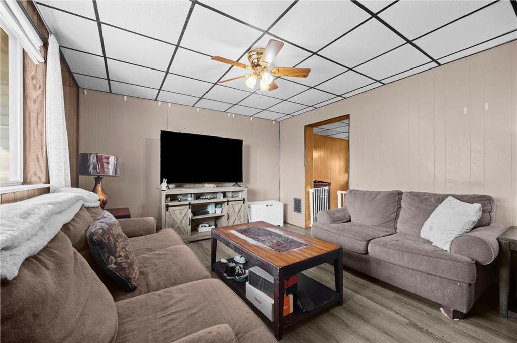 1412 Broadway Avenue McKees Rocks, PA 15136 - Photo 4 of 39 a living room with furniture and a flat screen tv