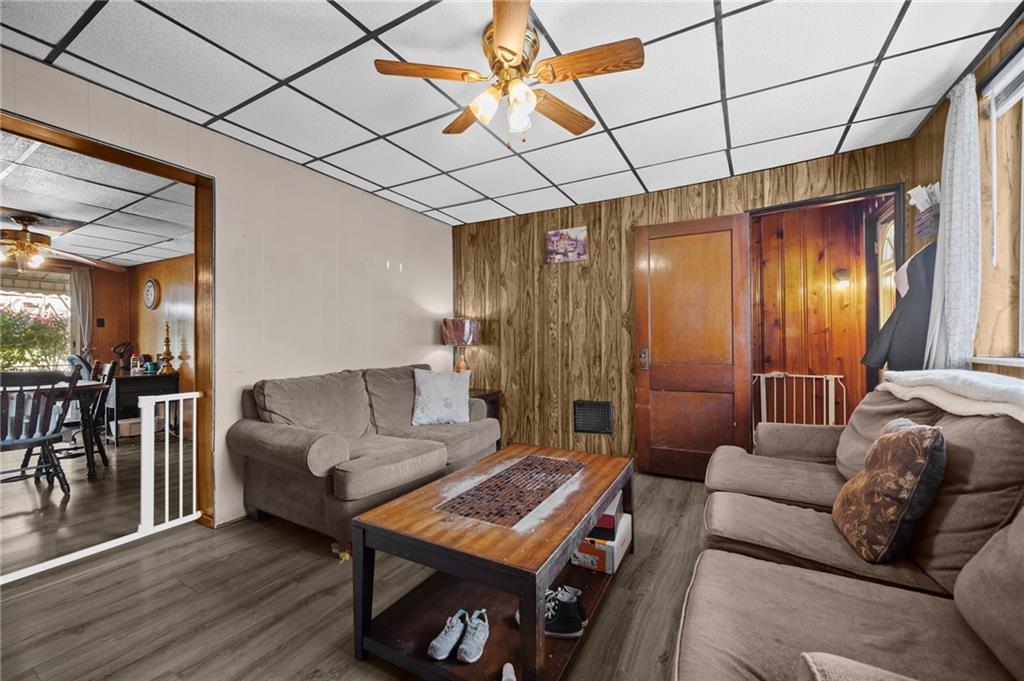 1412 Broadway Avenue McKees Rocks, PA 15136 - Photo 5 of 39 a living room with furniture a dining table and a refrigerator