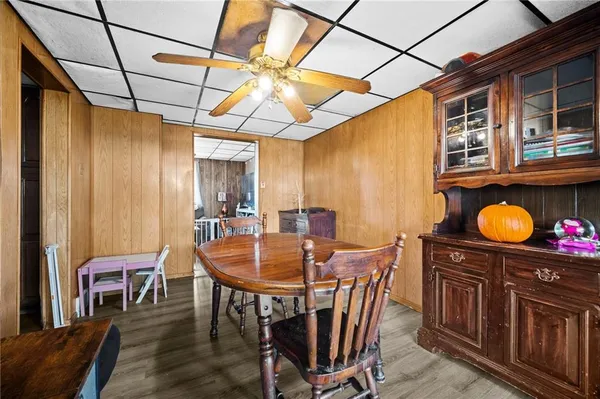 a dining room with furniture and window