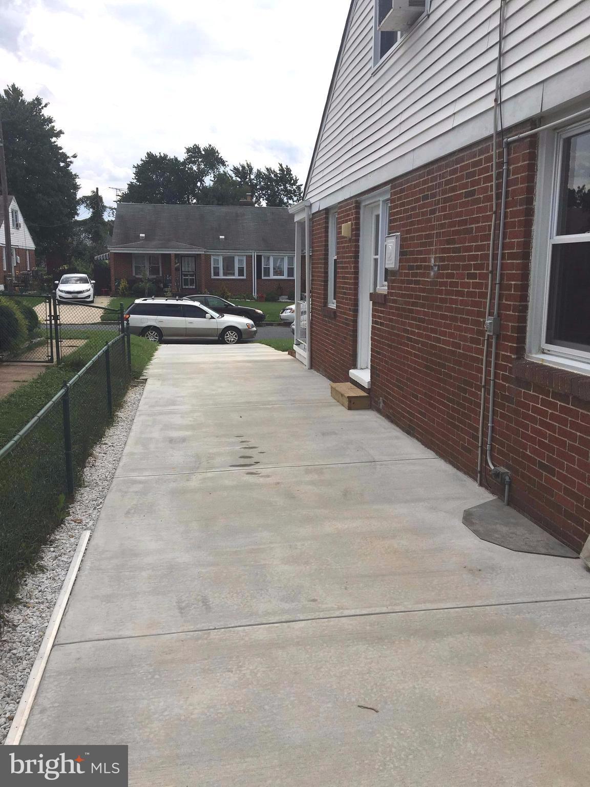 6516 Langdale Road Baltimore, MD 21237 - Photo 22 of 23 a view of a house with a roof deck