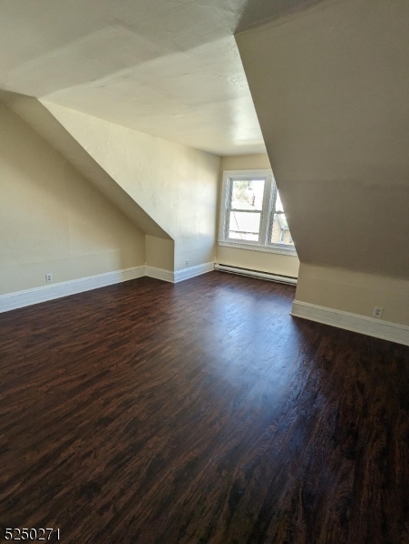 190 Chambers Street, Unit 2 Phillipsburg, NJ 08865 - Photo 7 of 10 an empty room with wooden floor and windows