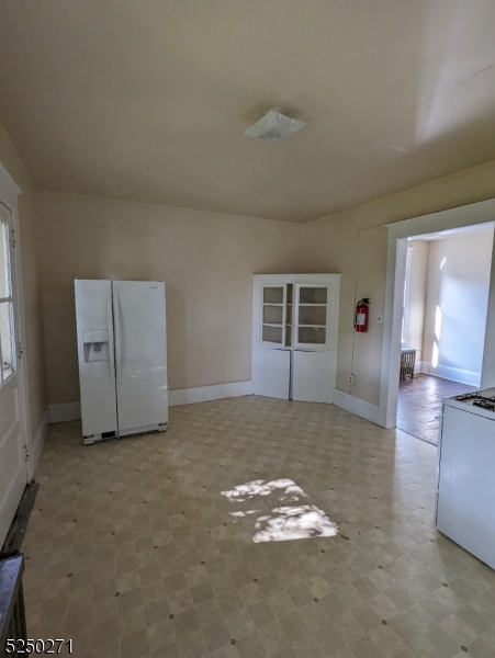 190 Chambers Street, Unit 2 Phillipsburg, NJ 08865 - Photo 9 of 10 a view of a livingroom with wooden floor and kitchen space
