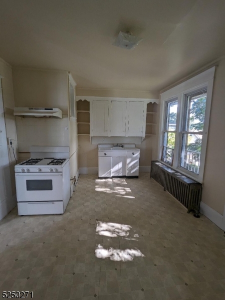 190 Chambers Street, Unit 2 Phillipsburg, NJ 08865 - Photo 10 of 10 a kitchen with a stove and a refrigerator