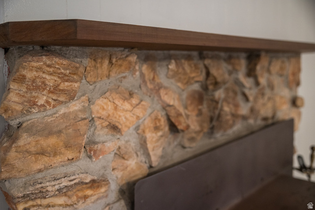 634 South 2100th Street West Vernal, UT 84078 - Photo 35 of 71 Stone-clad fireplace featuring a rich wood-finish mantelpiece