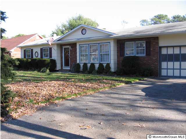 484 Bella Vista Road Brick, NJ 08724 - Photo 1 of 3 a front view of a house with a yard