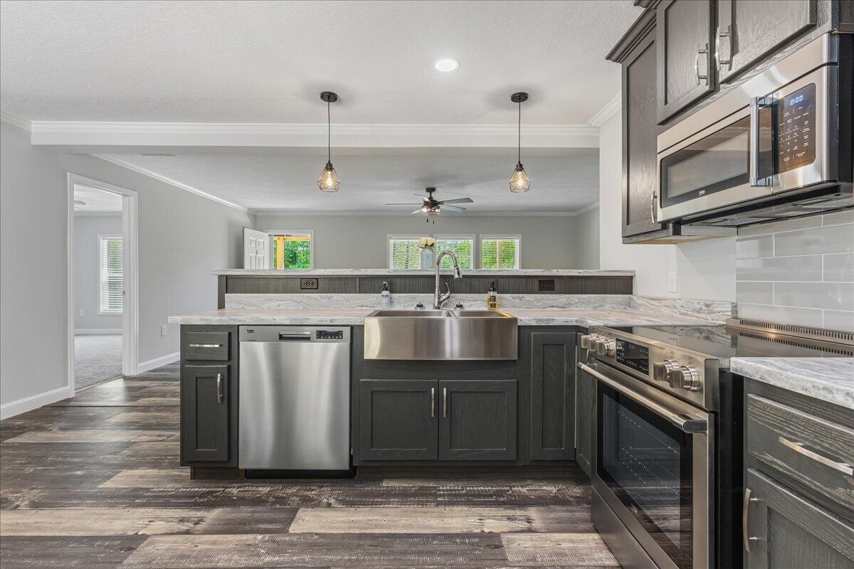 1629 Wasson Road Ten Mile, TN 37880 - Photo 15 of 27 a kitchen with stainless steel appliances granite countertop a stove a sink and a microwave