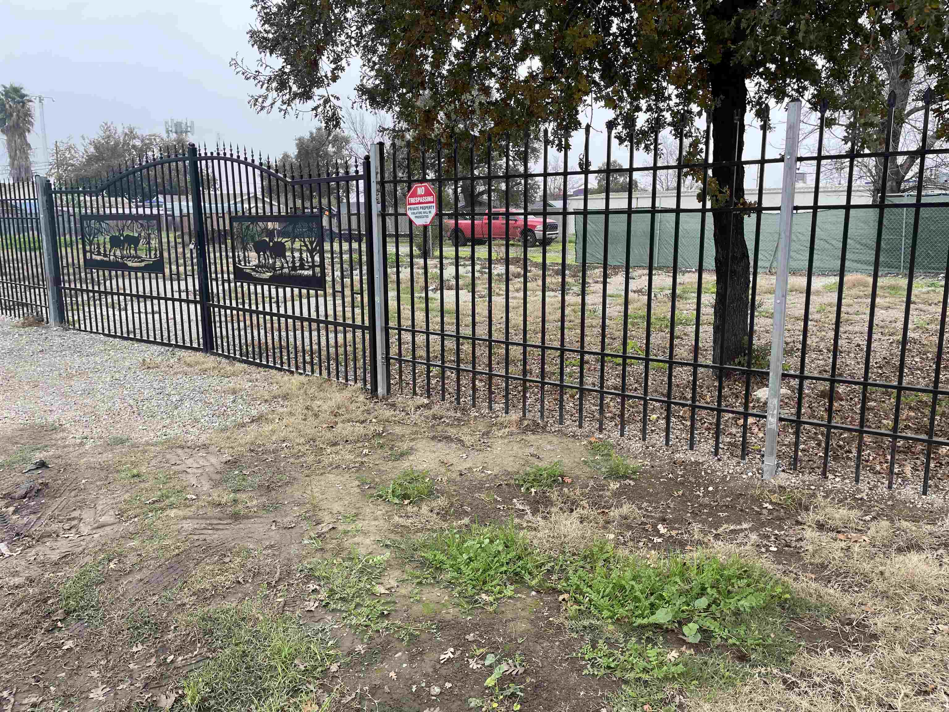 a view of a gate and fence