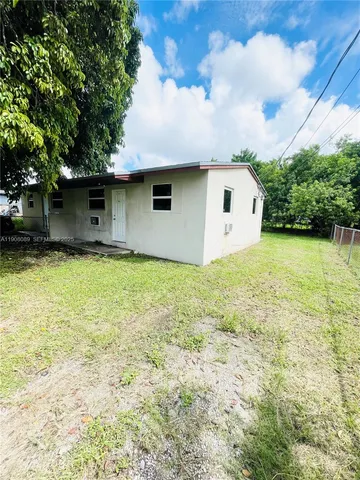 a house with yard in front of it