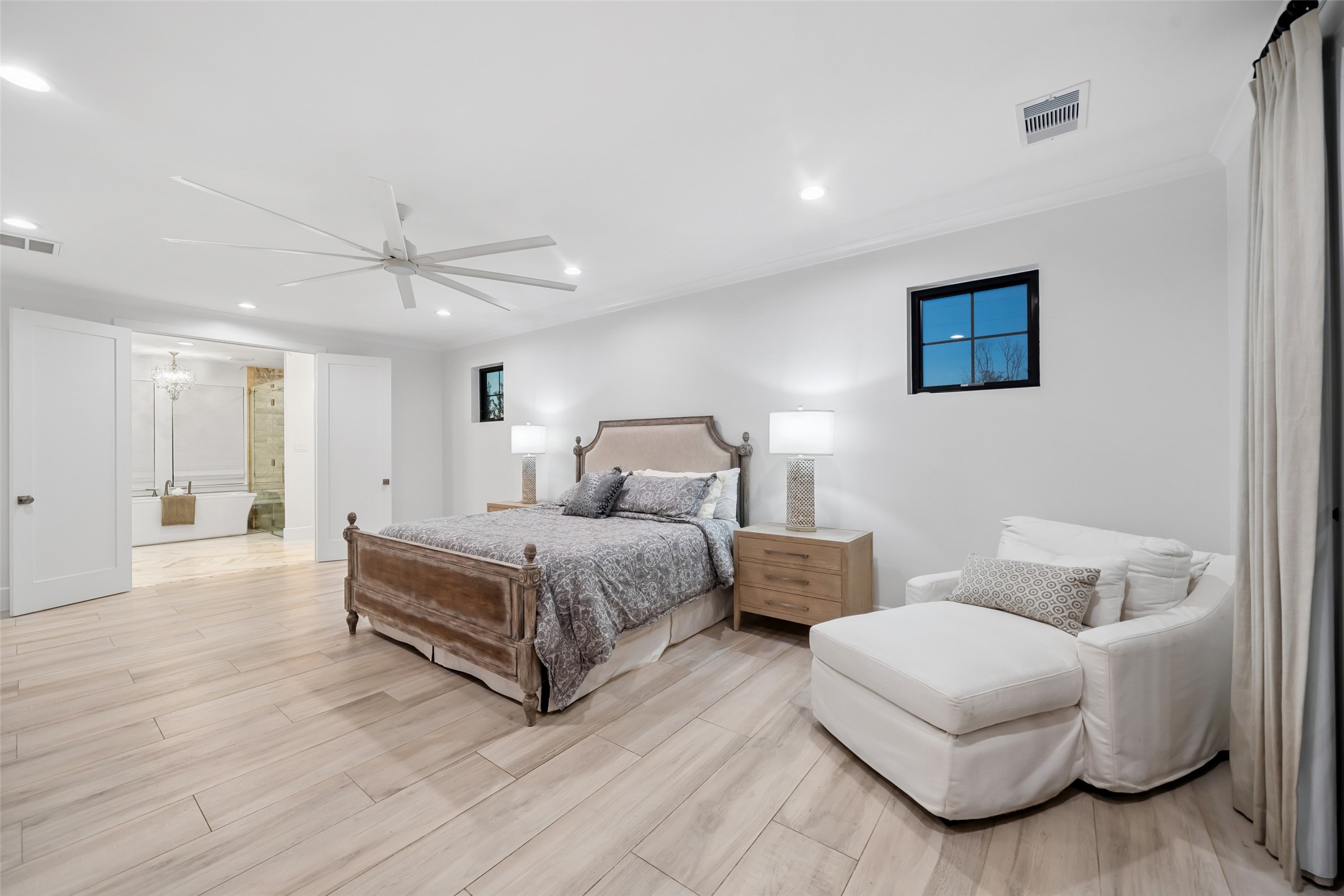 24118 Margerstadt Road Hockley, TX 77447 - Photo 18 of 50 With neutral finishes, crown molding, and generous proportions, the primary bedroom is both relaxing and refined—designed for comfort with dual ensuite baths nearby.