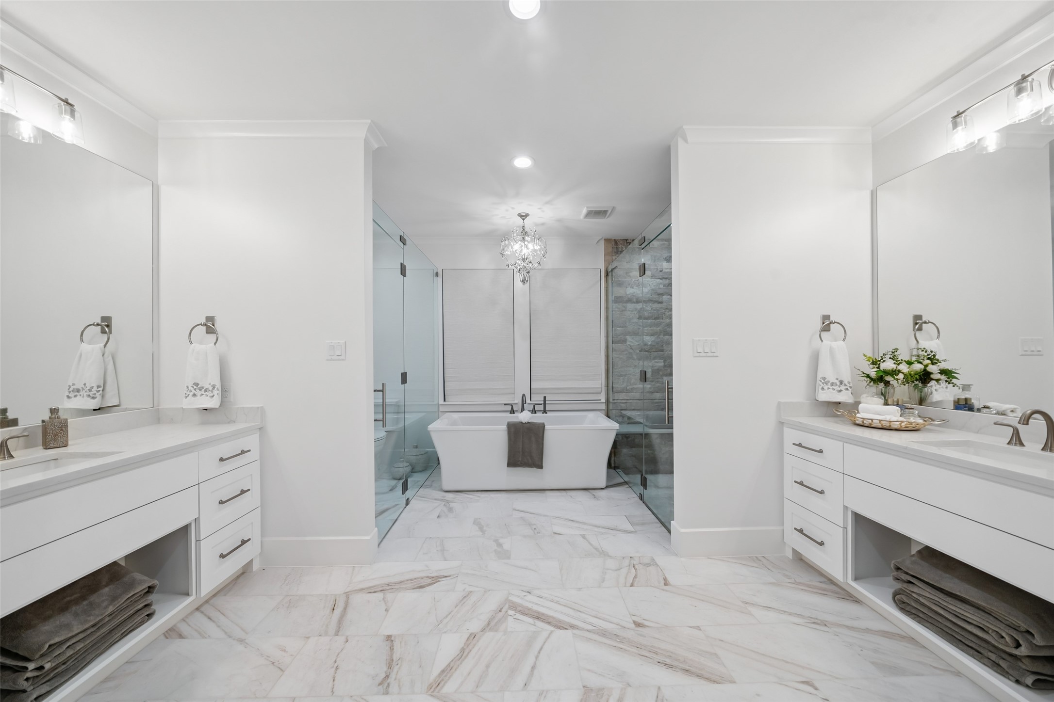 24118 Margerstadt Road Hockley, TX 77447 - Photo 20 of 50 Symmetry and spaciousness define this luxurious ensuite, complete with two vanities, a soaking tub and elegant lighting throughout.