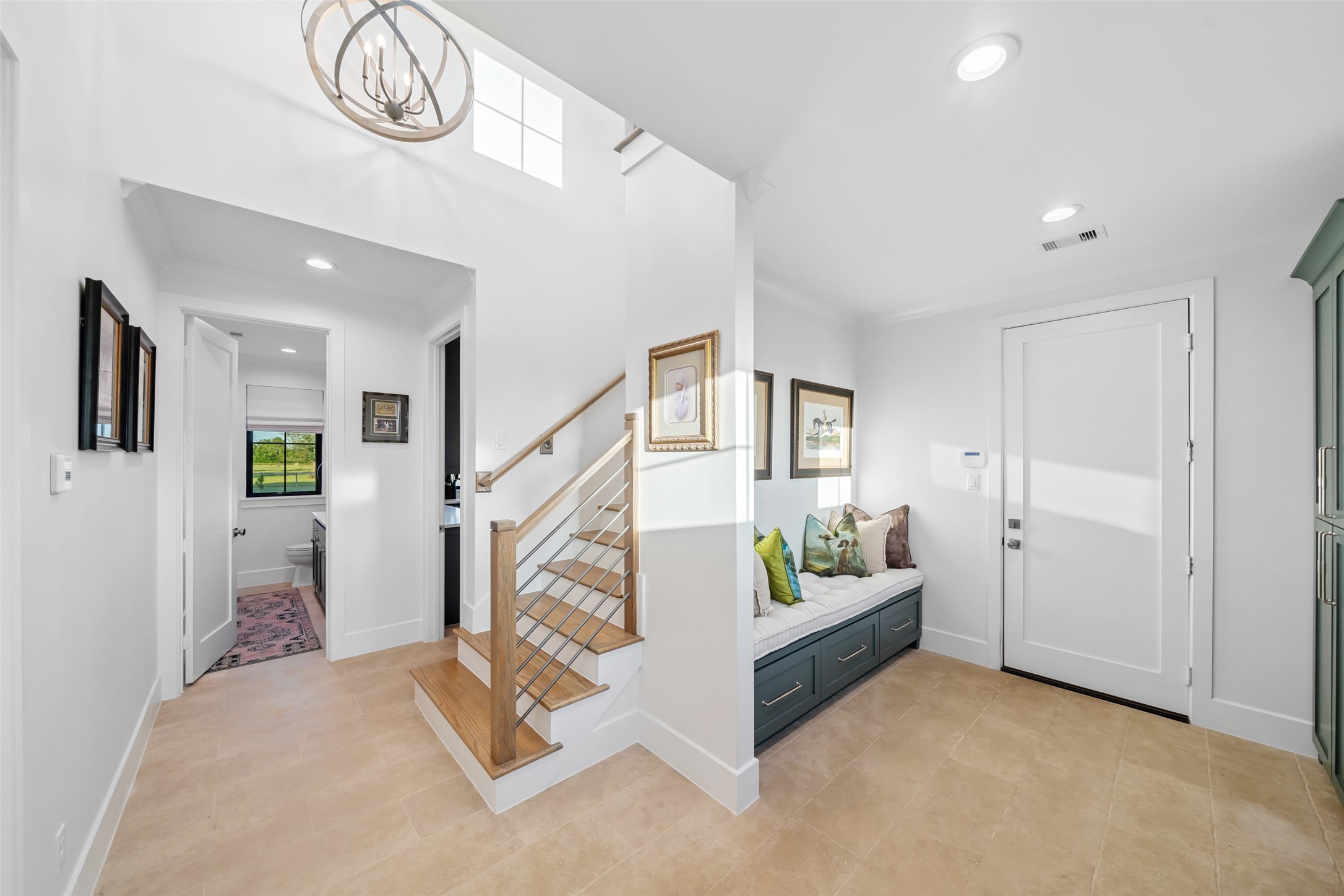 24118 Margerstadt Road Hockley, TX 77447 - Photo 26 of 50 Just off the garage entry, this bright drop zone includes a built-in bench with drawer storage and quick access to the powder room and staircase.