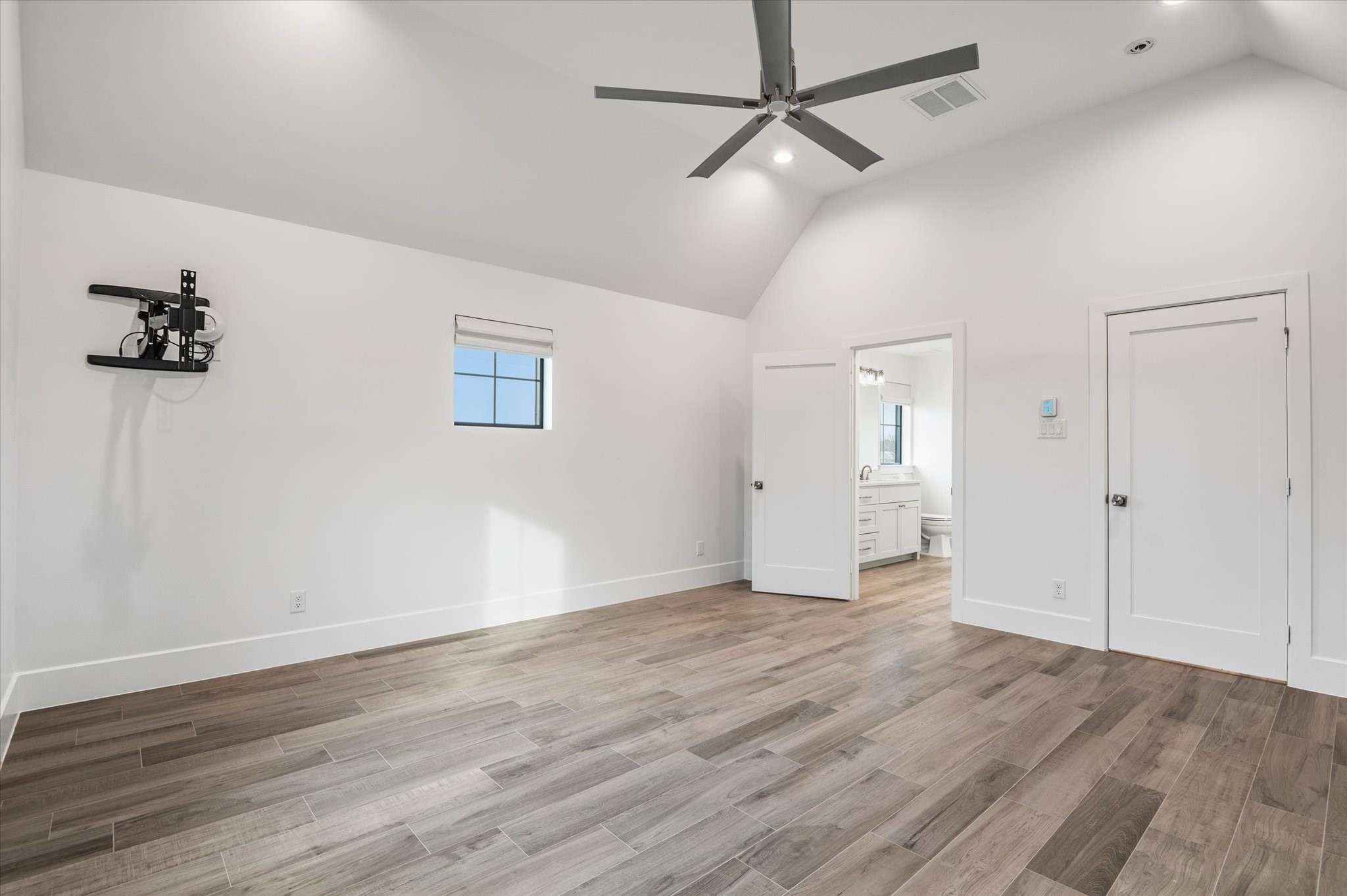 24118 Margerstadt Road Hockley, TX 77447 - Photo 27 of 50 Vaulted ceilings and natural light define this spacious upstairs bedroom, offering flexibility.
