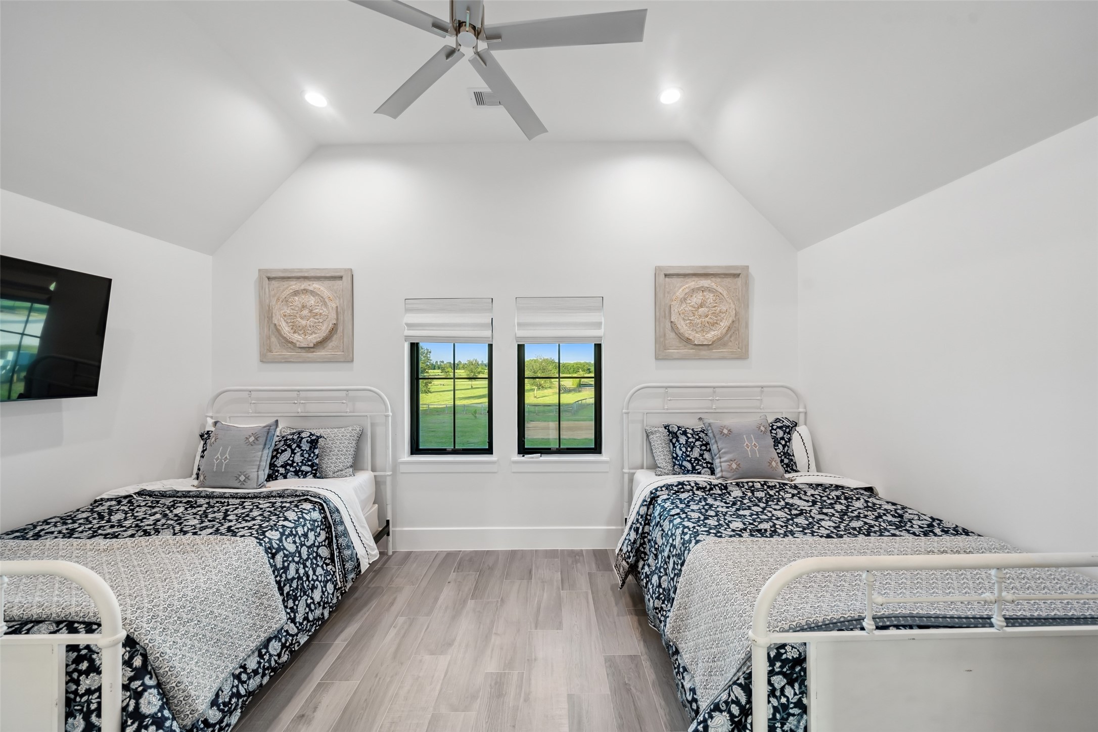 24118 Margerstadt Road Hockley, TX 77447 - Photo 29 of 50 Generously sized with dual windows and closet access, this upstairs bedroom offers flexibility as a guest suite or potential walk-in dressing room.