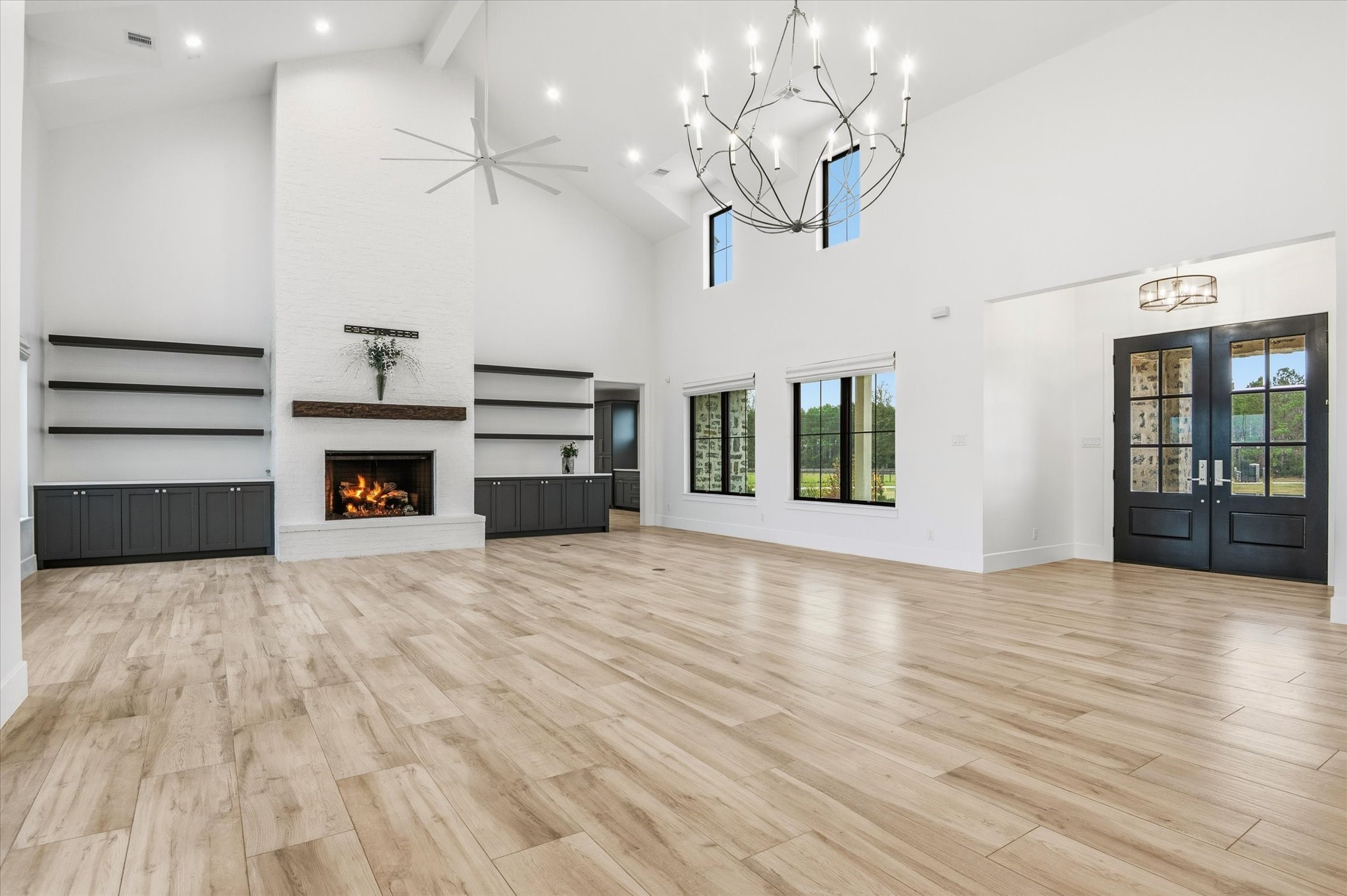 24118 Margerstadt Road Hockley, TX 77447 - Photo 5 of 50 Move-in ready this great room flows seamlessly into the gourmet kitchen and dining areas, ideal for entertaining or daily functionality, with views framing the surrounding property.