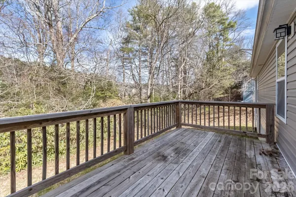 a view of balcony with wooden floor