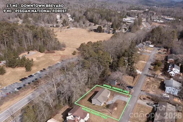view of a wooden fence with a yard