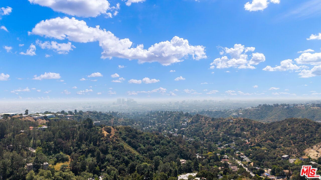2312 Kimridge Road Beverly Hills, CA 90210 - Photo 5 of 60 a view of a building in the background