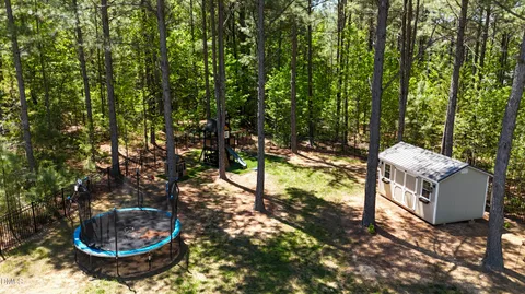 a view of outdoor space with playground and green space