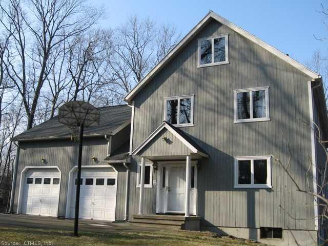 a front view of a house with garage