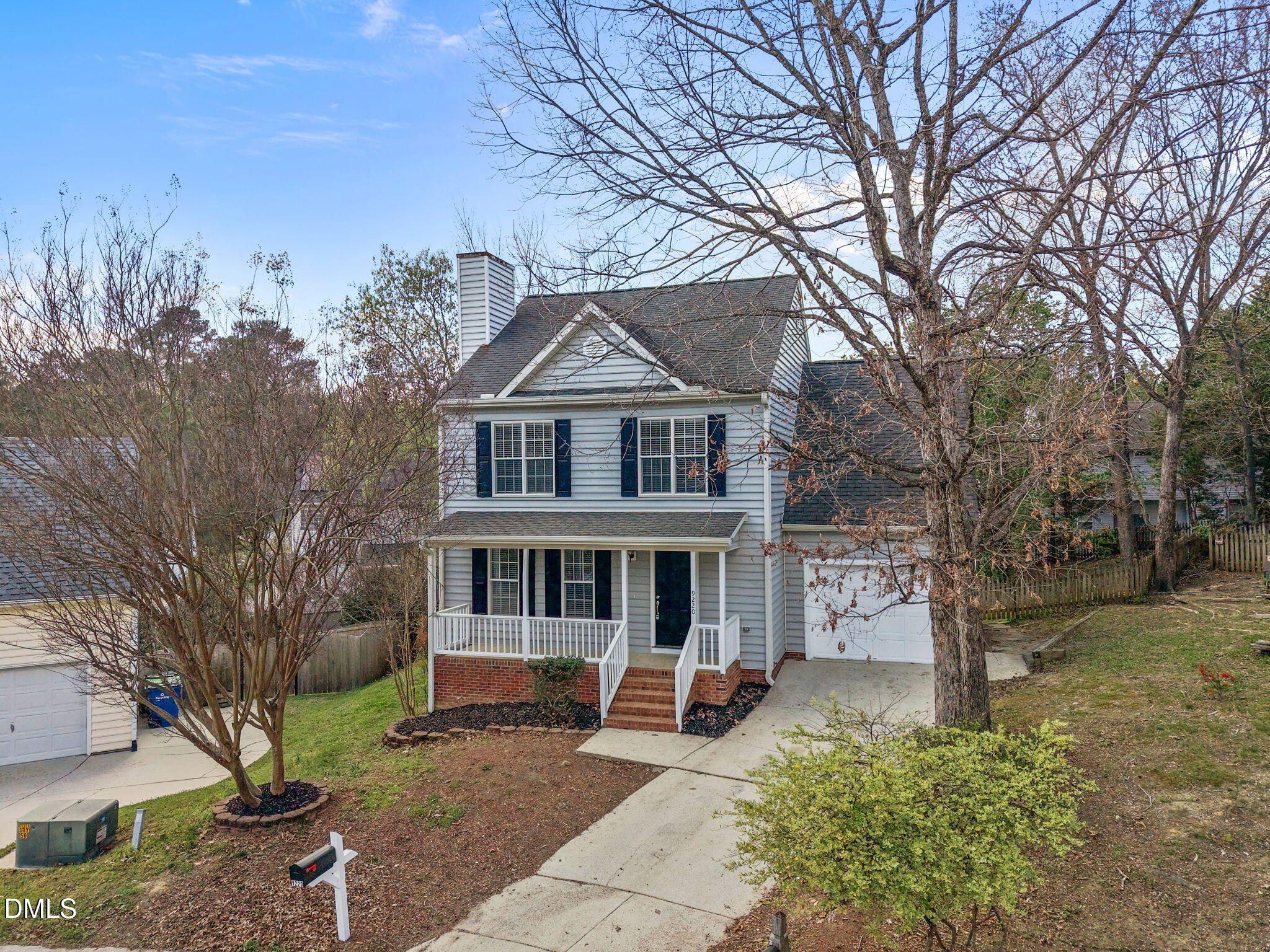 9220 Pennythorne Court Raleigh, NC 27615 - Photo 8 of 49 a front view of a house with a garden and trees
