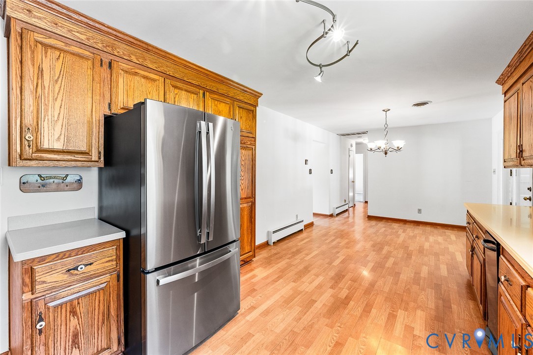 3815 Kingsland Road North Chesterfield, VA 23237 - Photo 11 of 40 a kitchen with stainless steel appliances granite countertop a refrigerator and a sink