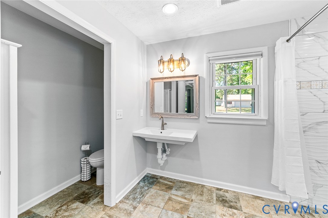 3815 Kingsland Road North Chesterfield, VA 23237 - Photo 17 of 40 a bathroom with a sink and a toilet