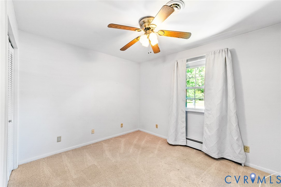3815 Kingsland Road North Chesterfield, VA 23237 - Photo 24 of 40 an empty room with windows and fan