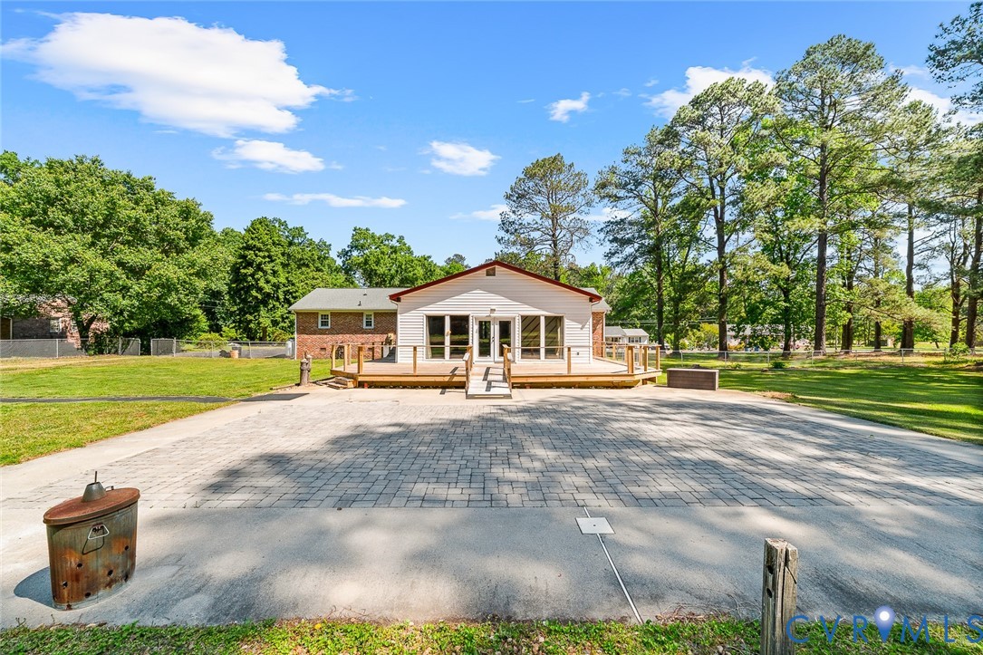 3815 Kingsland Road North Chesterfield, VA 23237 - Photo 31 of 40 a white house with a big yard and large trees