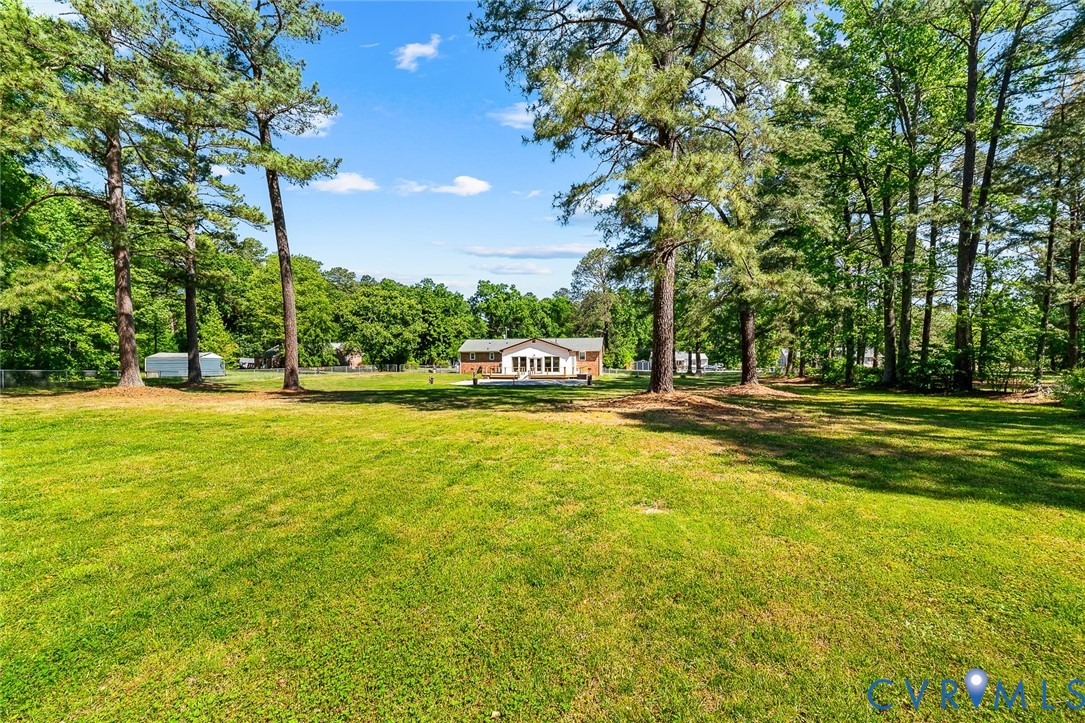 3815 Kingsland Road North Chesterfield, VA 23237 - Photo 34 of 40 a house view with swimming pool in front of it