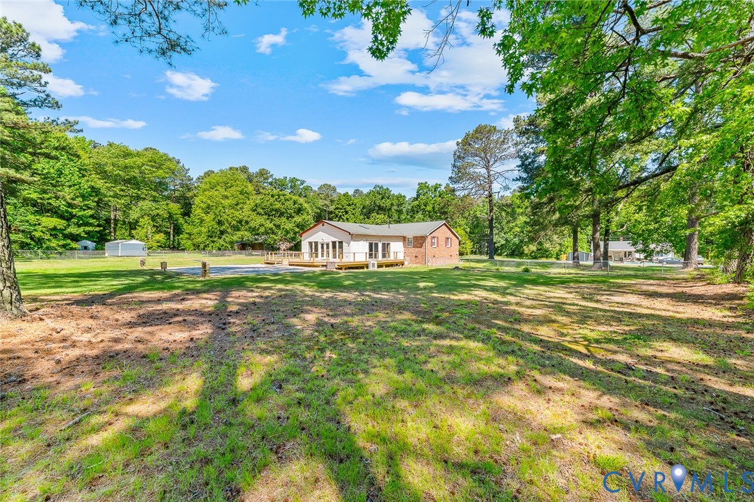 3815 Kingsland Road North Chesterfield, VA 23237 - Photo 35 of 40 a green field with lots of trees in the background
