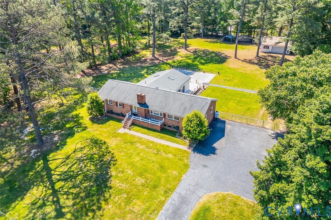 3815 Kingsland Road North Chesterfield, VA 23237 - Photo 37 of 40 a view of a swimming pool with an outdoor seating and yard