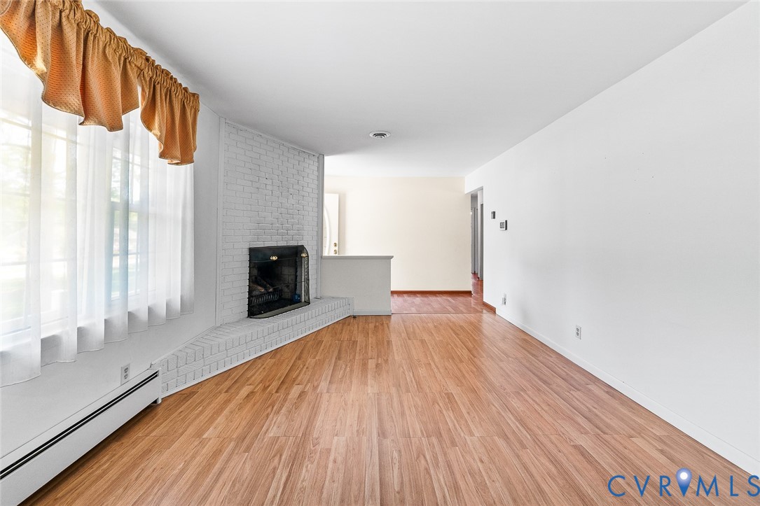 3815 Kingsland Road North Chesterfield, VA 23237 - Photo 7 of 40 a view of empty room with wooden floor and fan