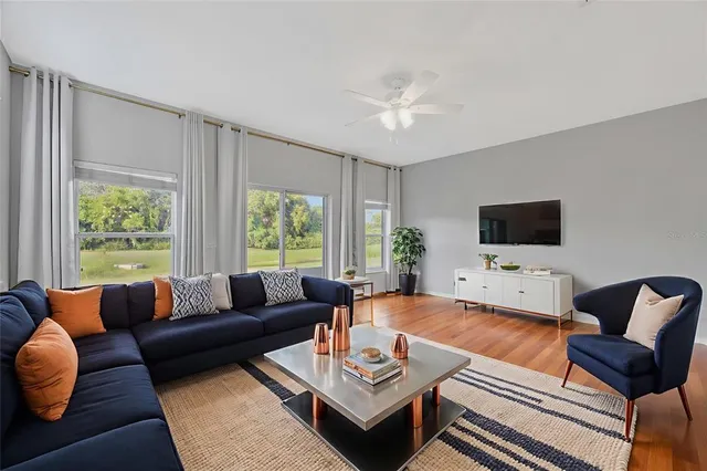 a living room with furniture and a large window
