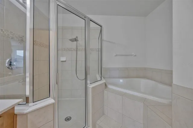 a bathroom with a shower and bathtub