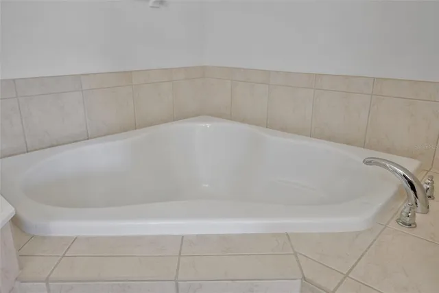 a white bath tub sitting in a bathroom