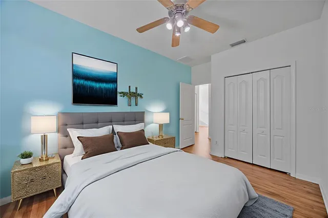 a white toilet sitting next to a shower