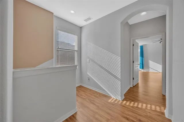 a bathroom with a sink a mirror and a window