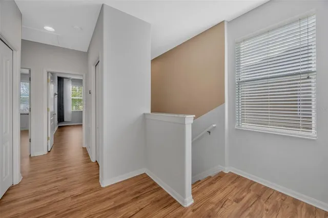 a view of an entryway with wooden floor
