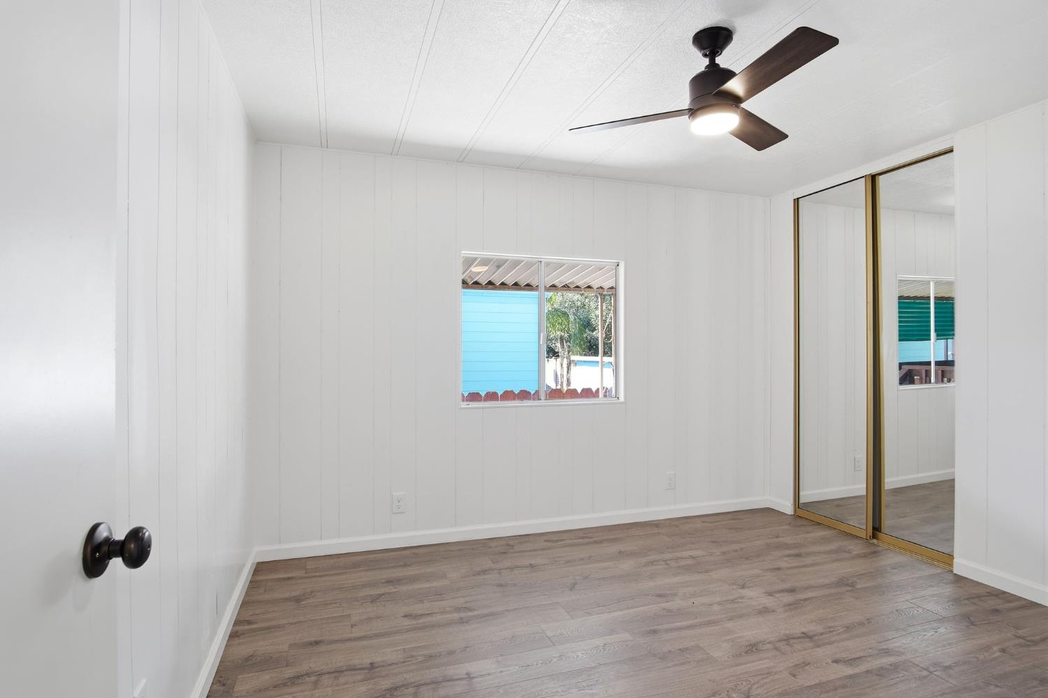 1200 South Carpenter Road, Unit 10 Modesto, CA 95351 - Photo 12 of 27 wooden floor in an empty room