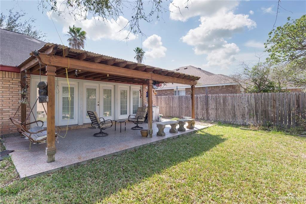 1801 Crown Pointe Boulevard Mission, TX 78572 - Photo 16 of 19 a view of a house with backyard sitting area and garden