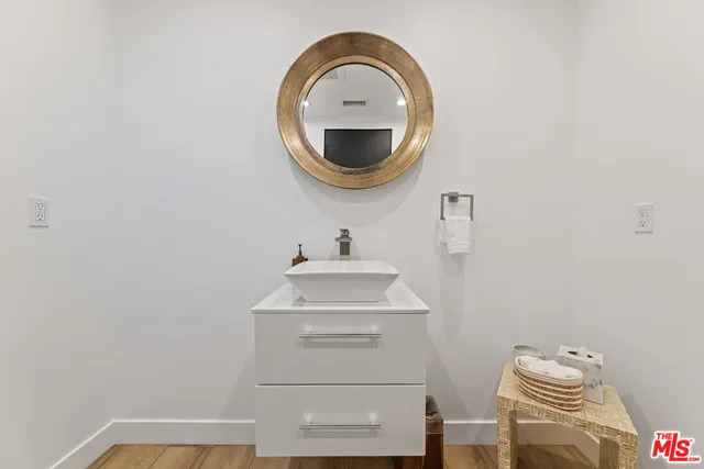 a bathroom with a sink and a mirror
