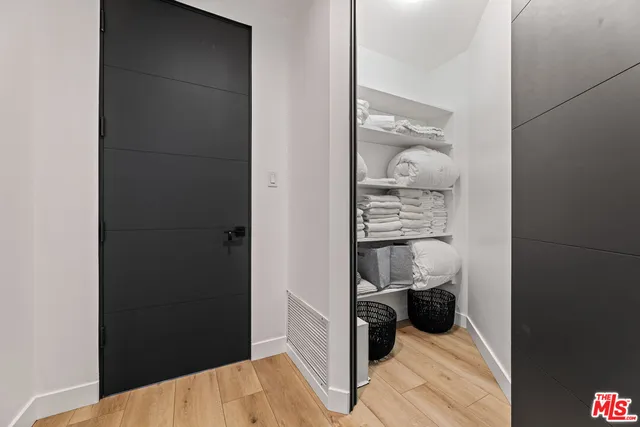 a view of a bedroom from a hallway