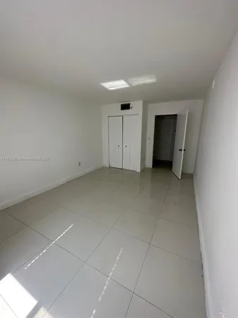 a bathroom with a sink toilet a mirror and bathtub